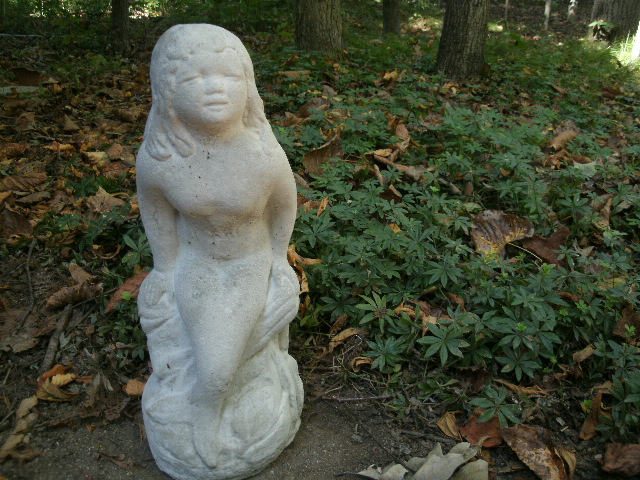 large concrete mermaid statue