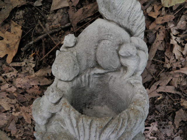 cement squirrel statue