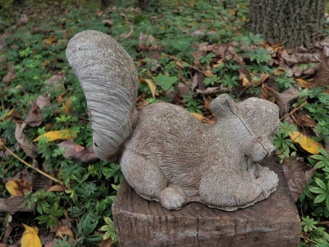 cement squirrel statue